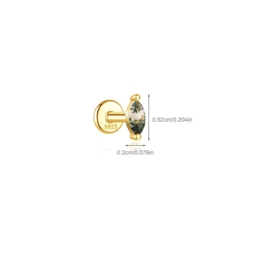 Gold earring with a green gemstone on a white background