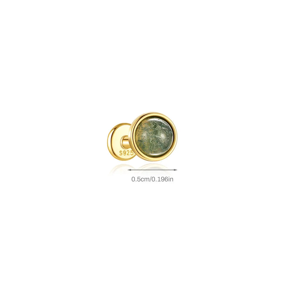 Gold earring with moss agate gemstone on a white background