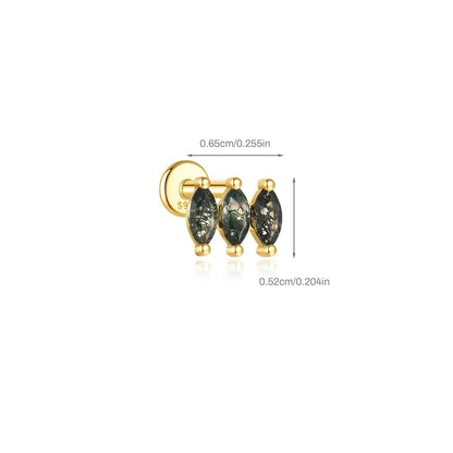 Gold earring with three green gemstones on a white background