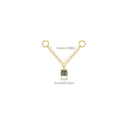 Gold necklace with a green gemstone pendant on a white background